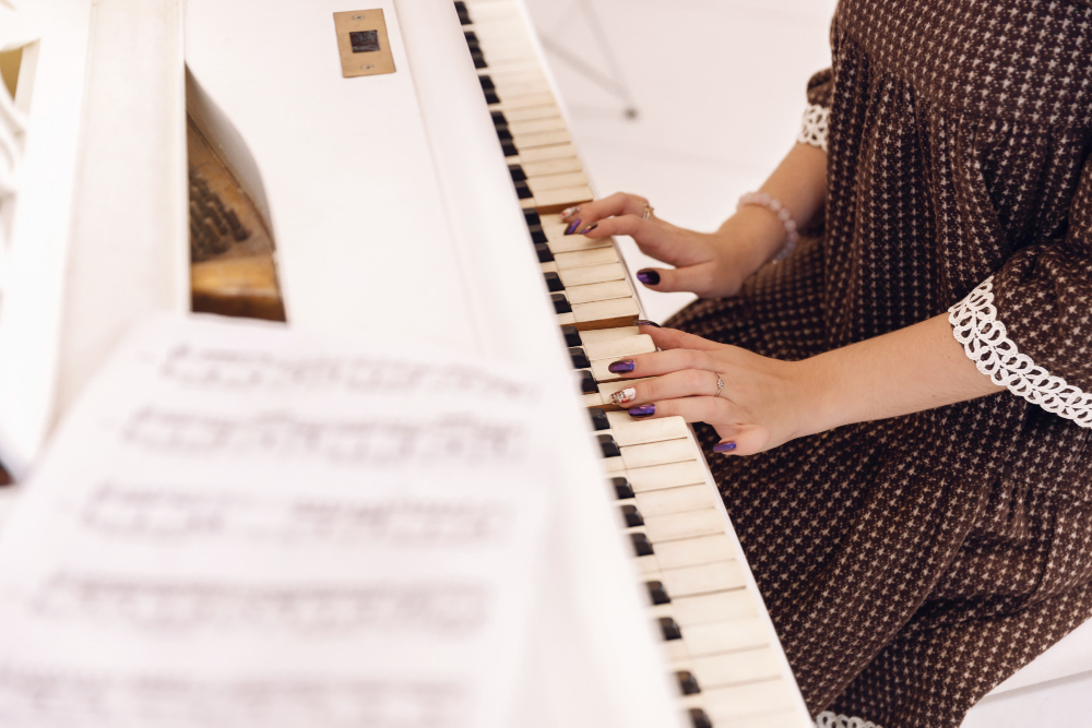 closeup-female-hands-playing-piano-keyboard